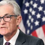 Fed holds rates steady, takes less confident view on inflation